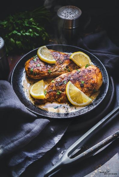 a delicious roasted chicken with lemon slices