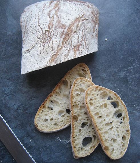 a half loaf and loaf slices of Ciabatta bread