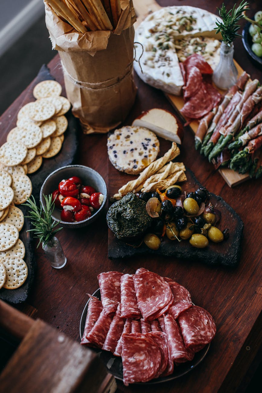 various appetizers arranged on a wooden table