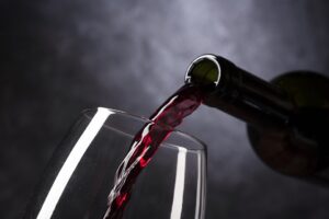 wine being poured on a wine glass