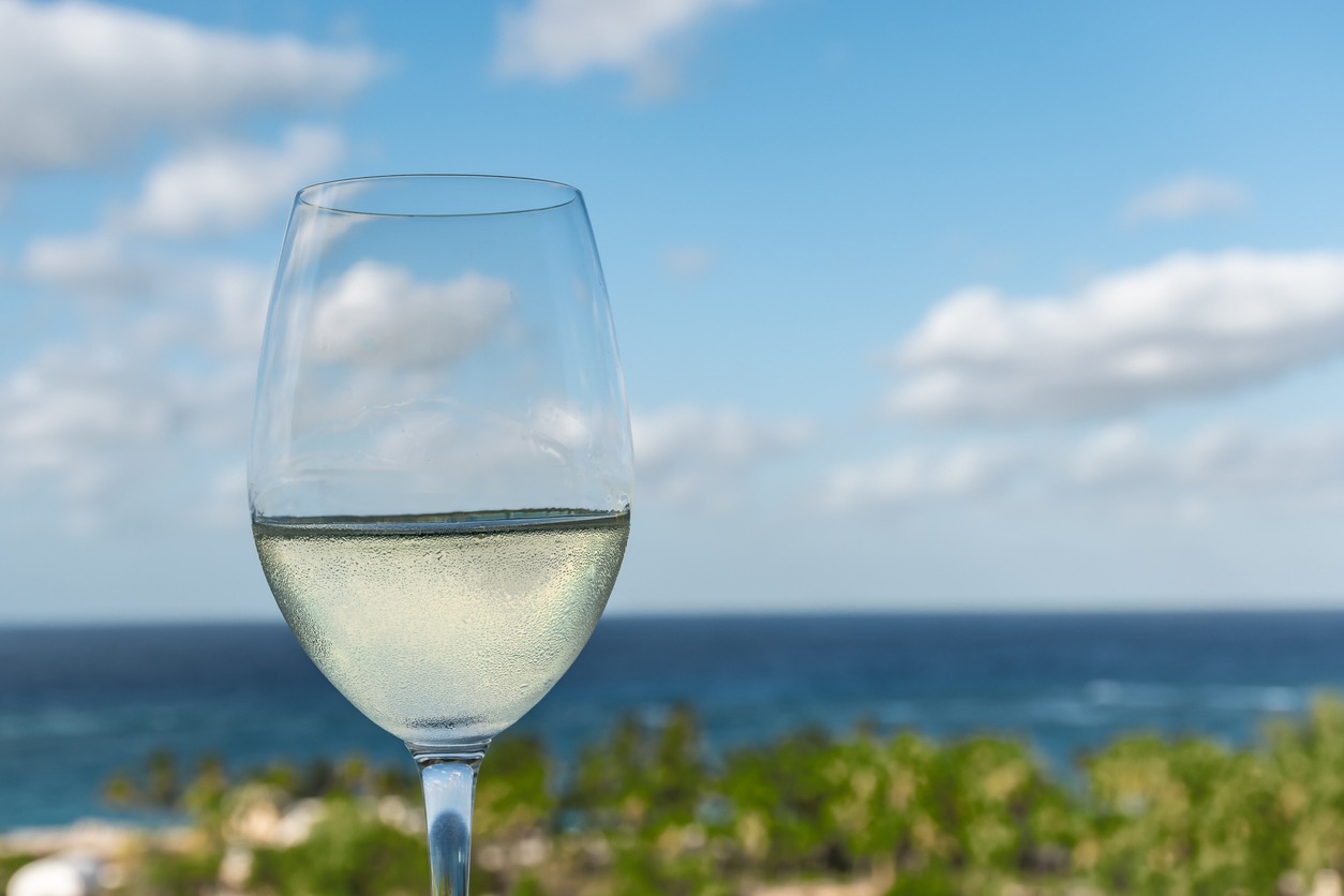 Glass of white wine on a tropical vacation
