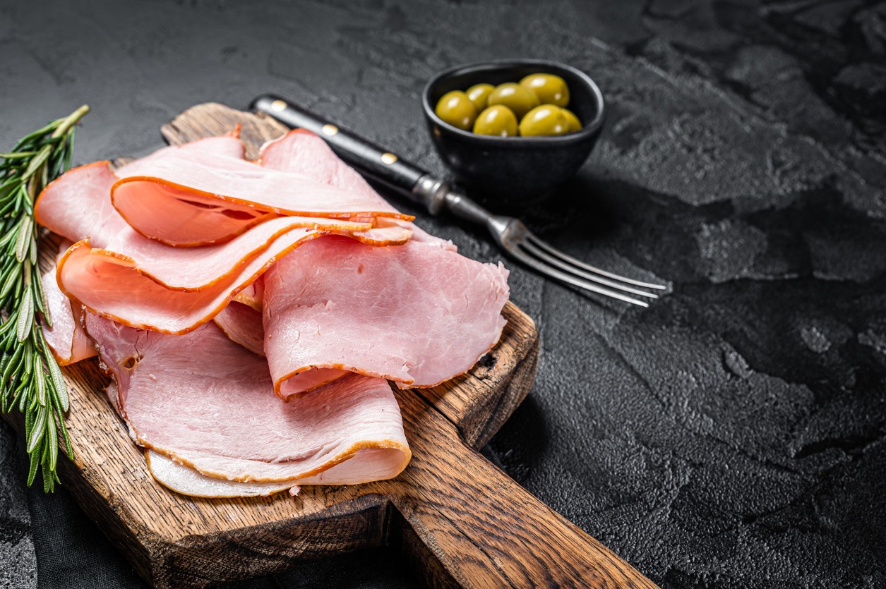 Pork ham slices on cutting board, Italian Prosciutto cotto