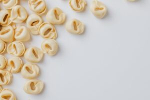 Image of Uncooked pouches or bows of Fiocchetti pasta.
