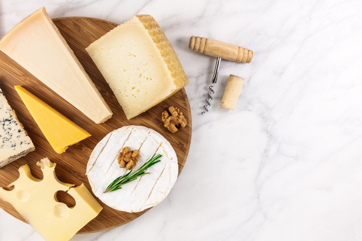 Selection of cheeses with corkscrew