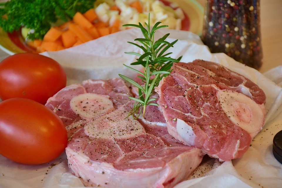 raw veal being prepared for cooking osso buco