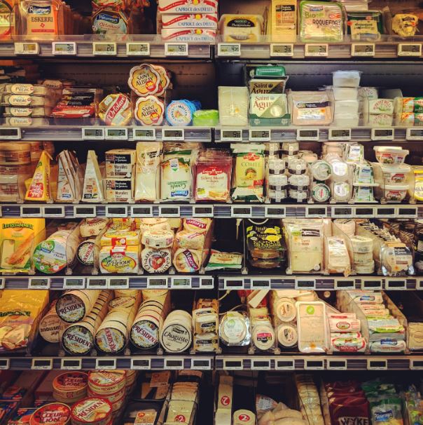 Assorted frozen cheese on shelves