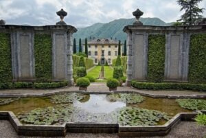 Villa Balbiano, pond, waterlilies, garden, cypress trees, walls, mountains