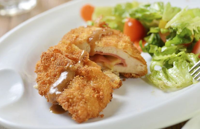 chicken cordon bleu, salad, plate, fork
